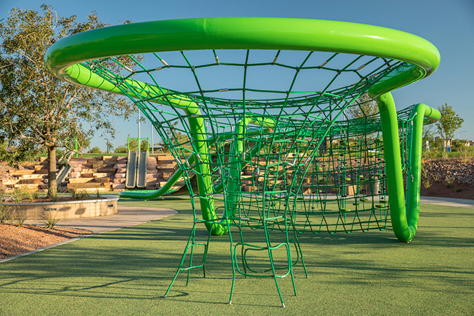 A green and blue playground slide.