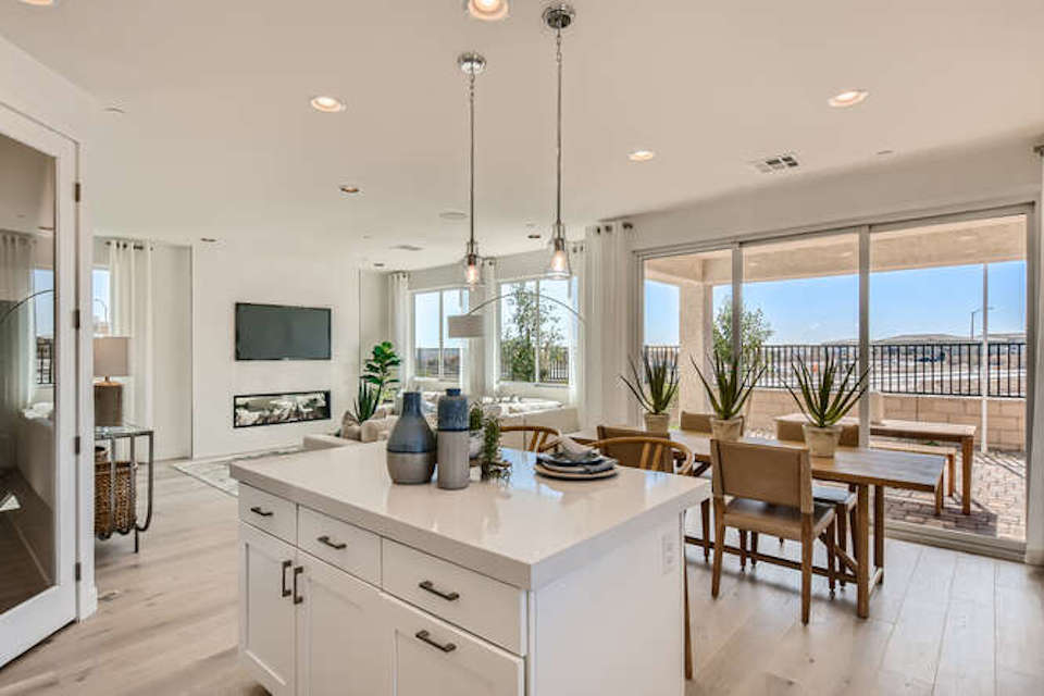 A kitchen with a large window.