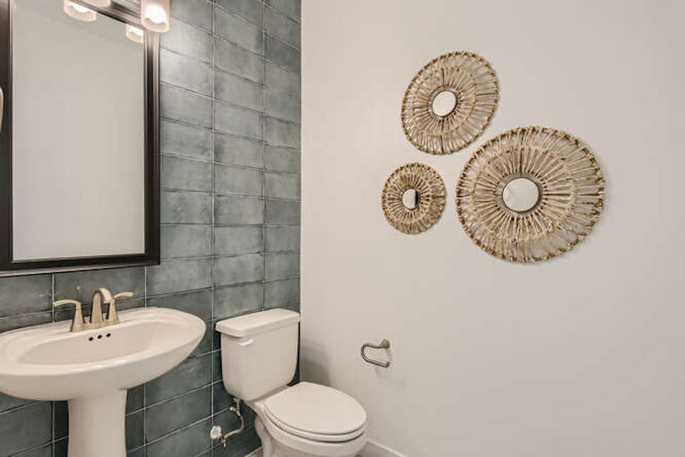 A bathroom with a toilet and a sink.