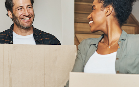 A man and a woman laughing.