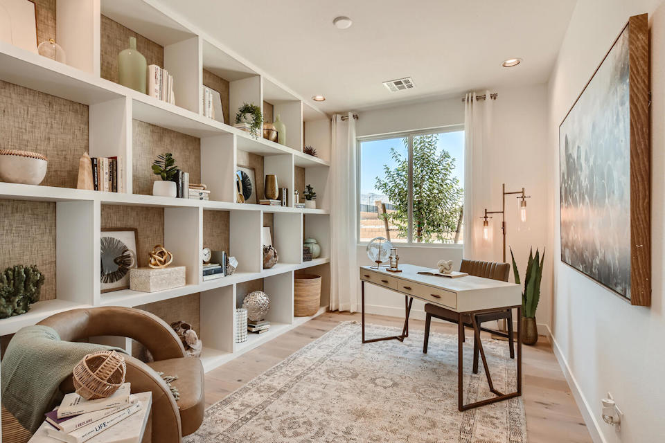 A room with a table and shelves.