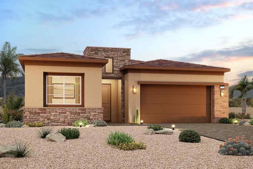 A house with a gravel driveway.