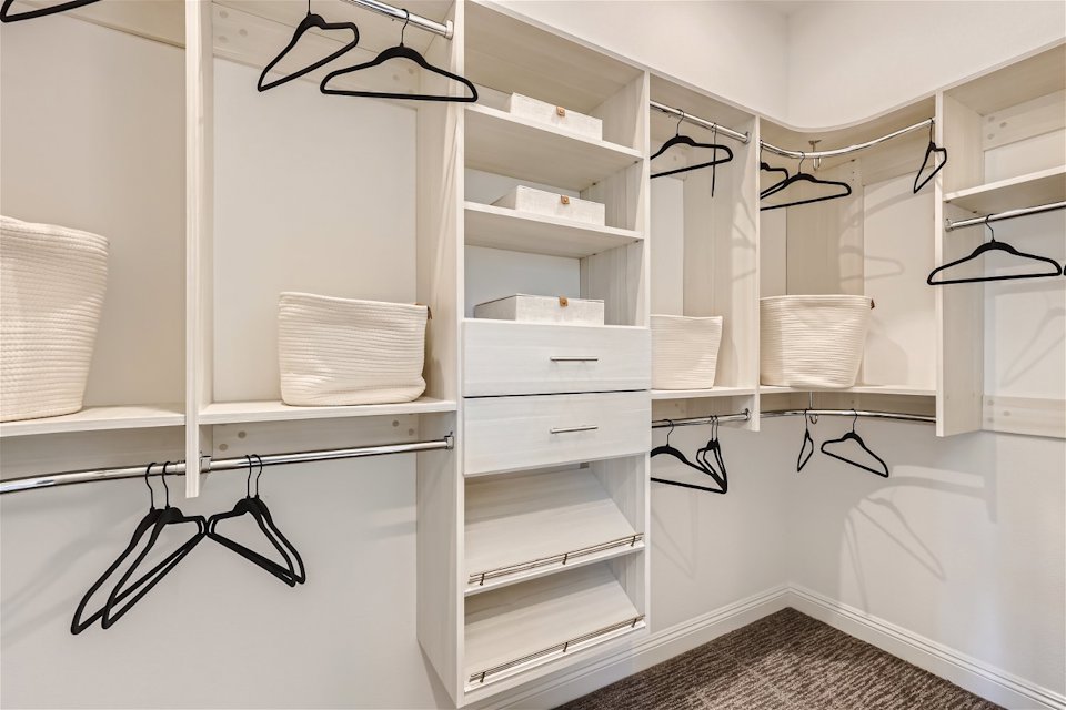 A room with shelves and a table.