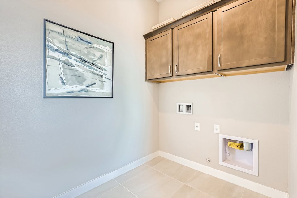 A room with a picture on the wall.