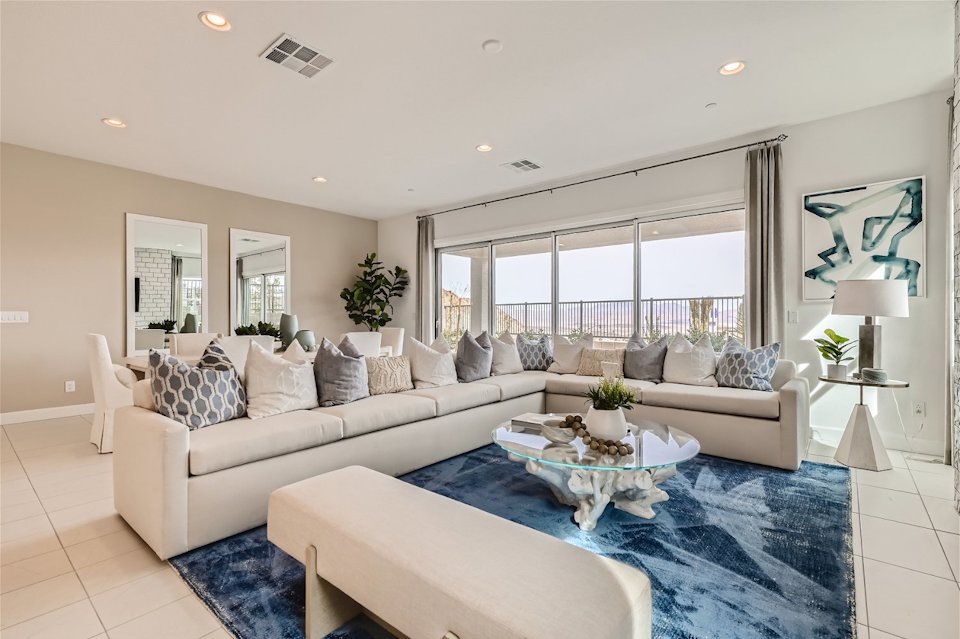 A large living room with a large window.