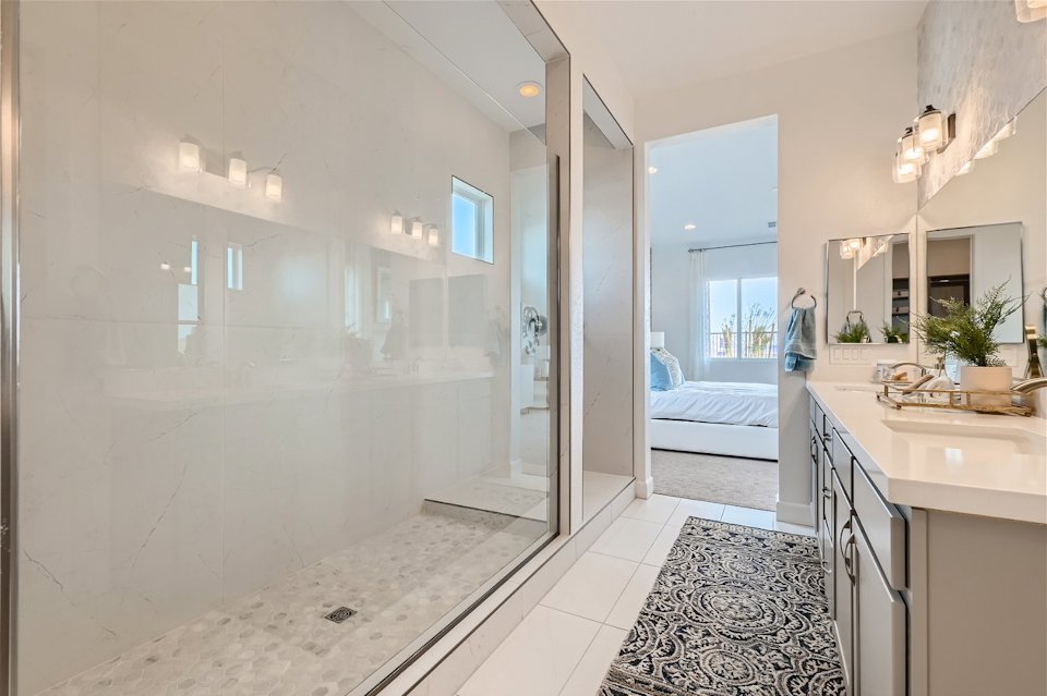 A bathroom with a glass shower.
