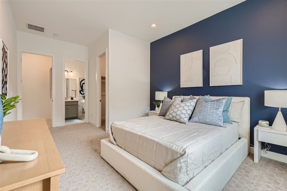 A living room with a couch and a table.