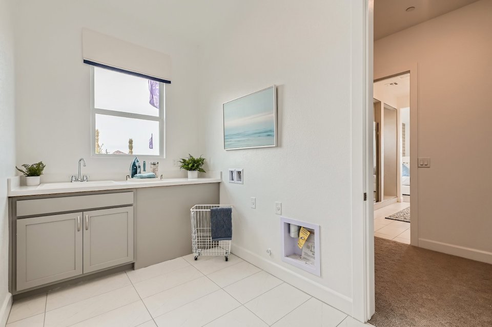 A bathroom with white tiles.