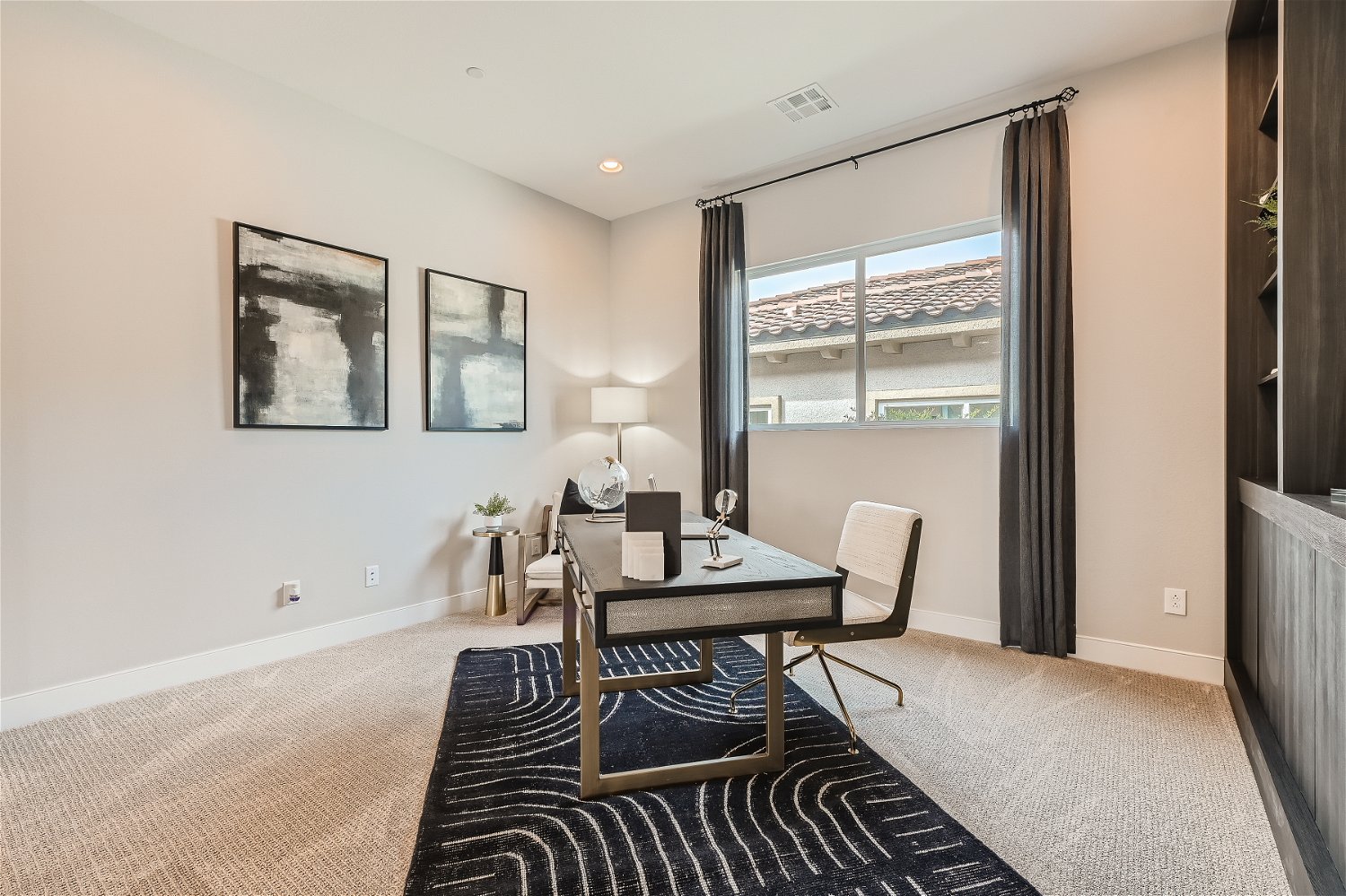 A room with a table and chairs.