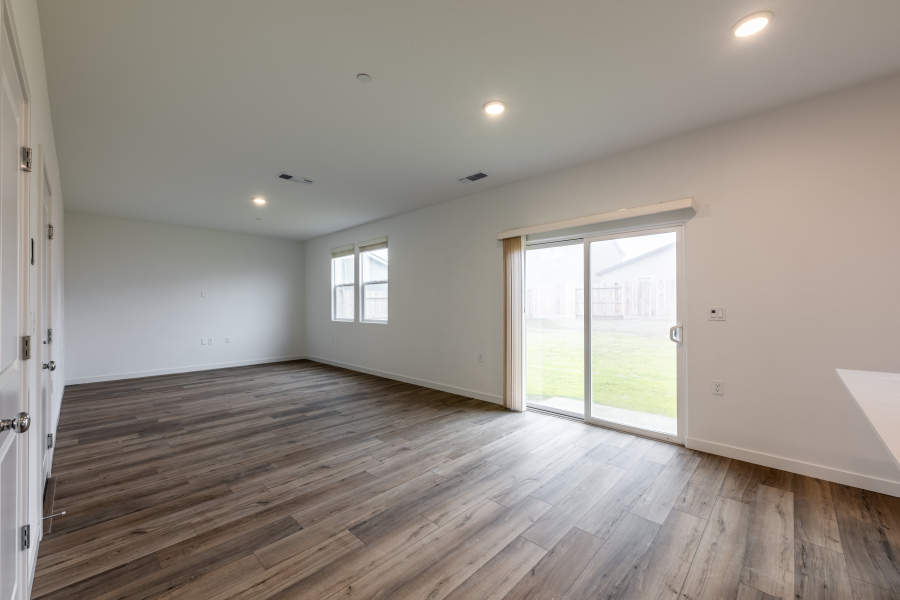 A room with a wood floor and a wood floor.