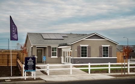A house with a sign in front.