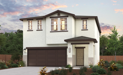 A house with a garage and trees.