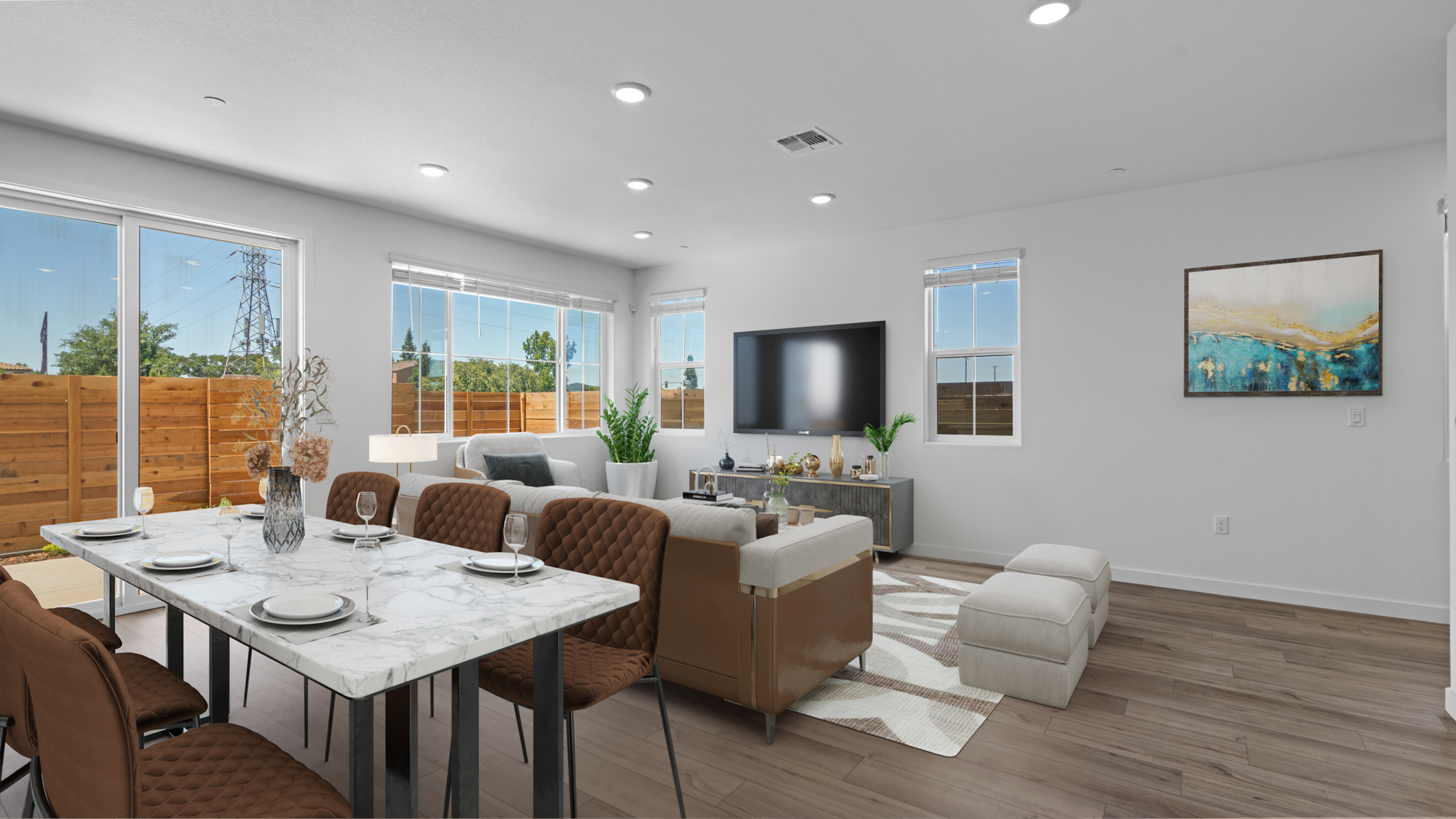 A living room with a large table and chairs.
