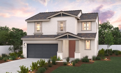 A white house with a garage.