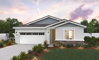 A house with a lawn and trees.