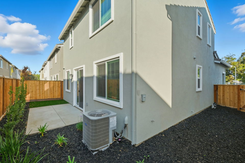 A white house with a fence.