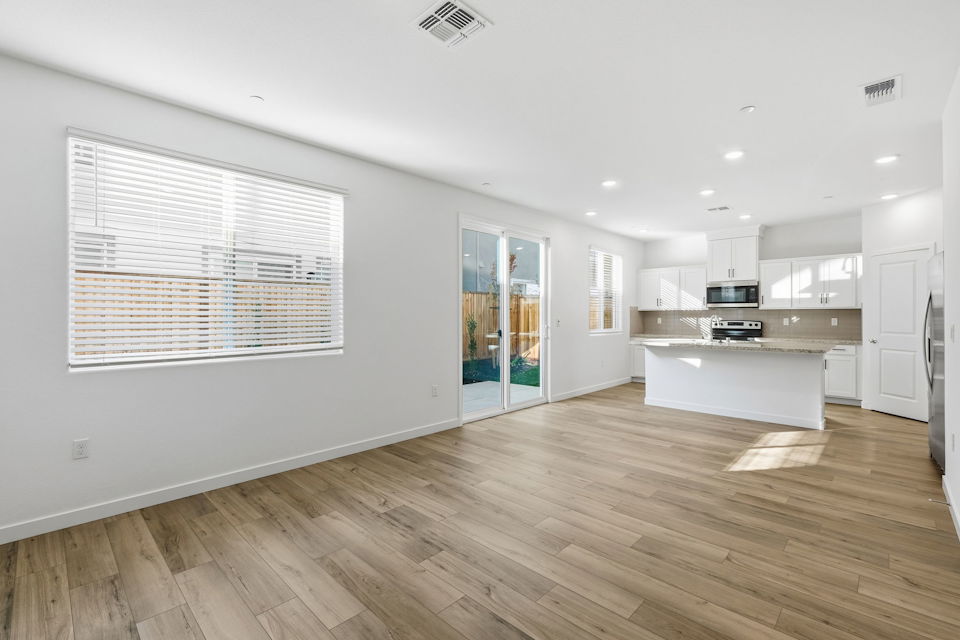 A kitchen with white walls.