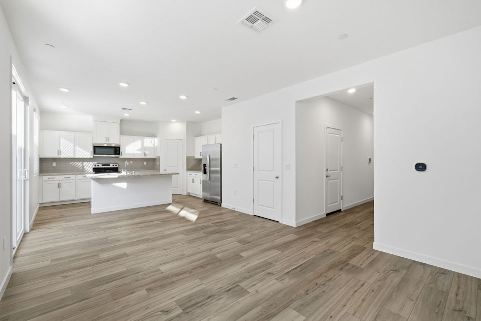 A large kitchen with white cabinets.