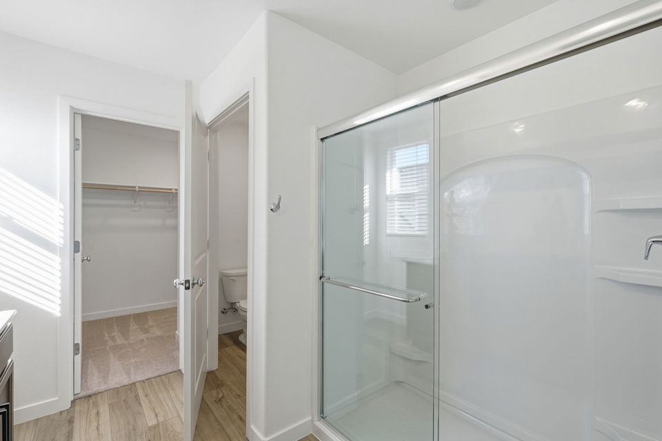 A bathroom with a shower unit.
