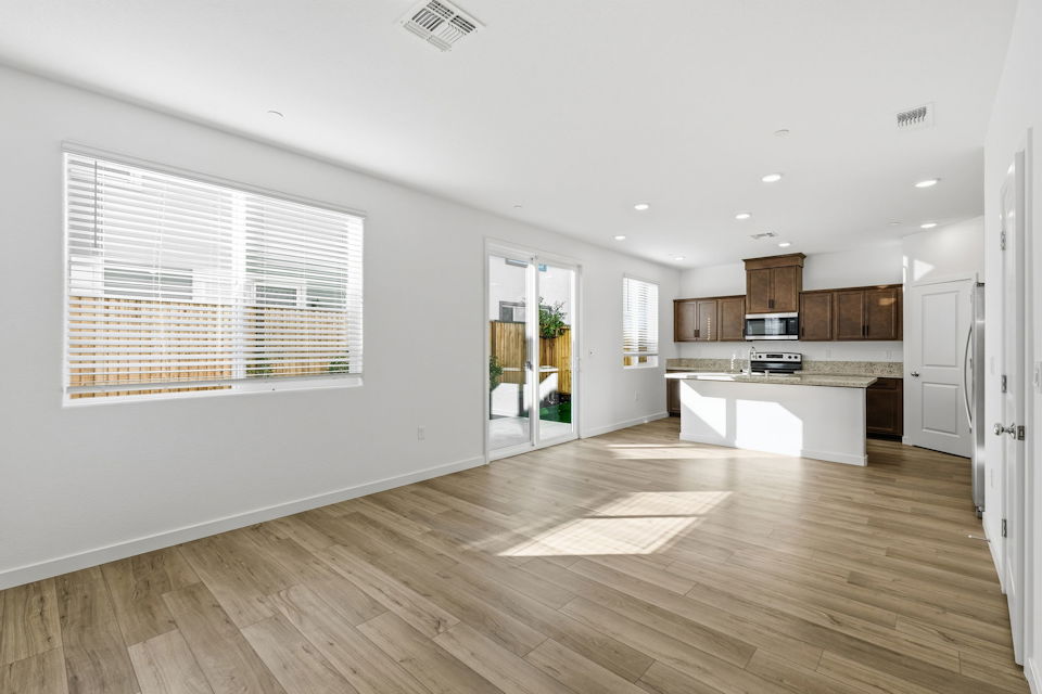 A kitchen with wooden floors.