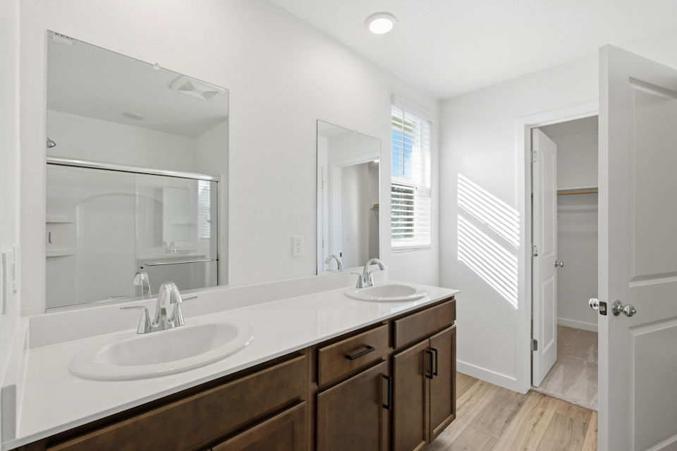 A bathroom with a large mirror.