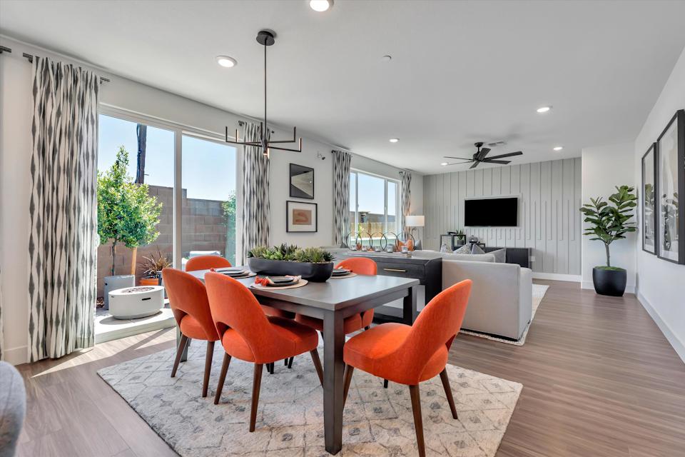 A room with a table and chairs.