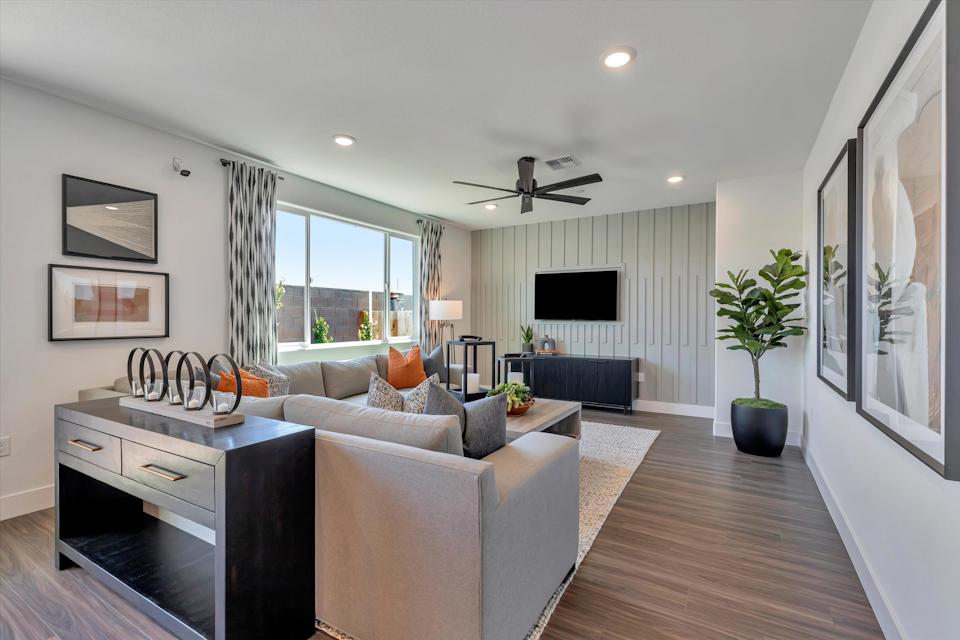 A living room with a tv and couches.