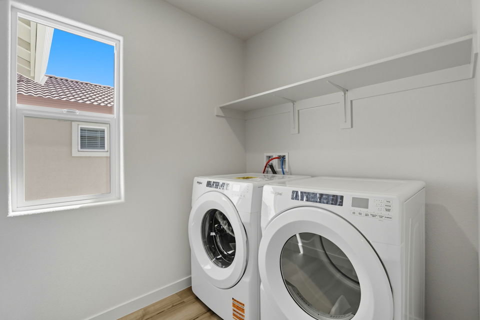 A washing machine in a room.