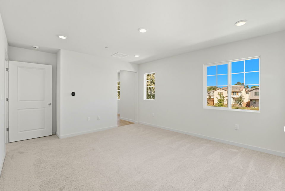 A room with white walls and windows.