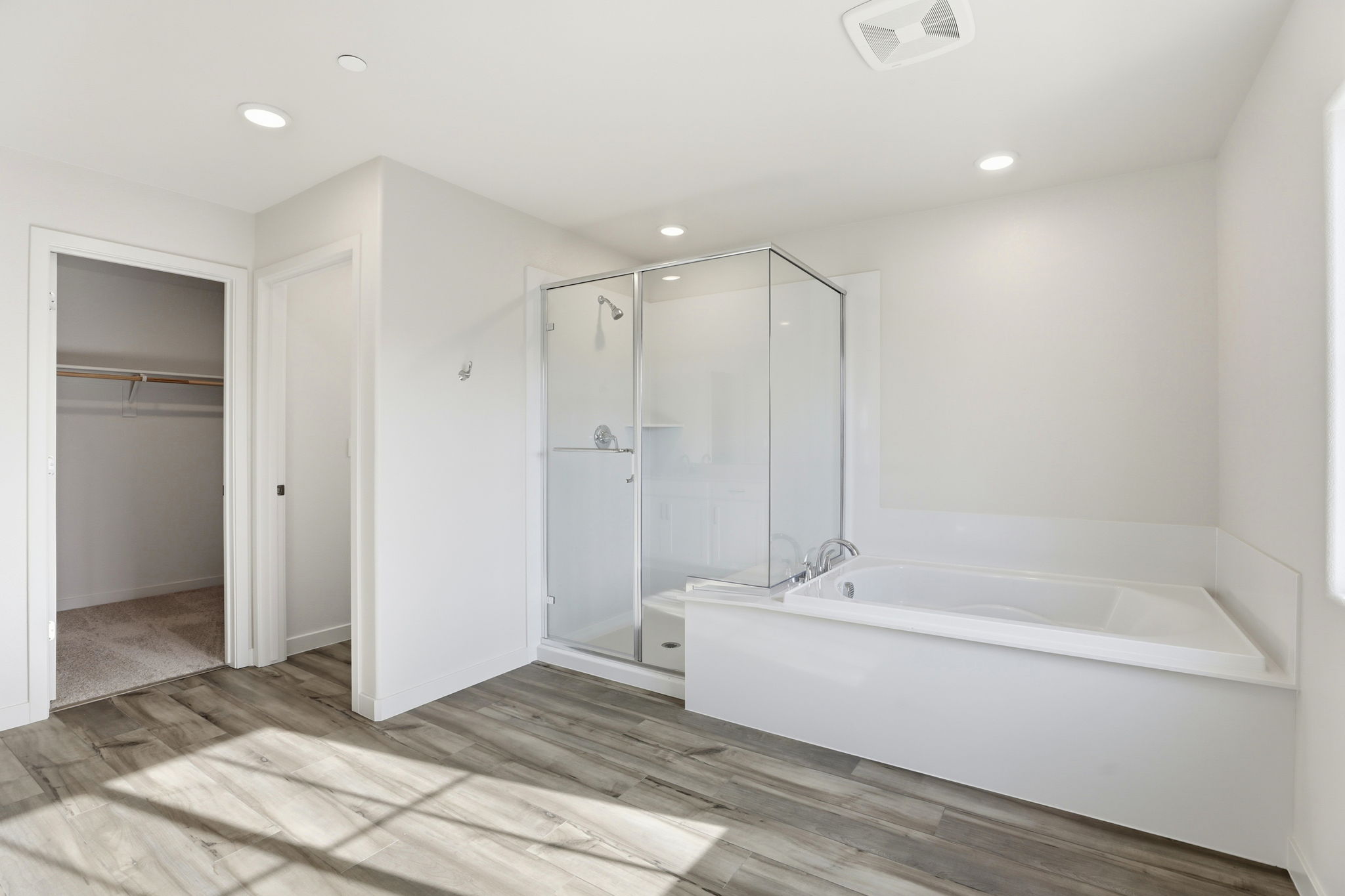 A bathroom with a tub and shower.
