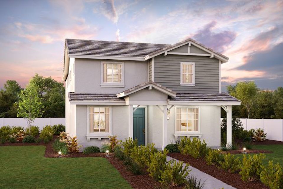 A house with a yard and a fence.