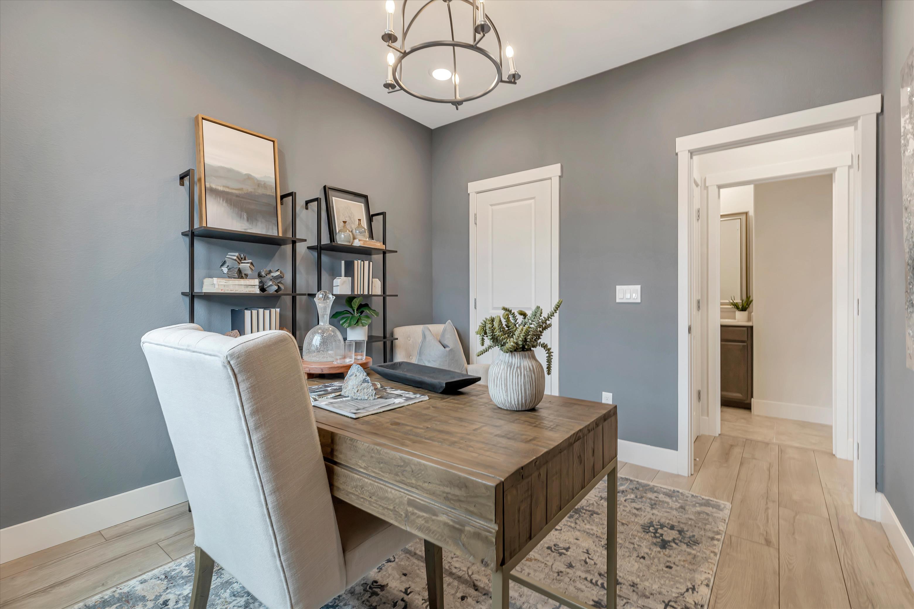 A room with a desk and chair.