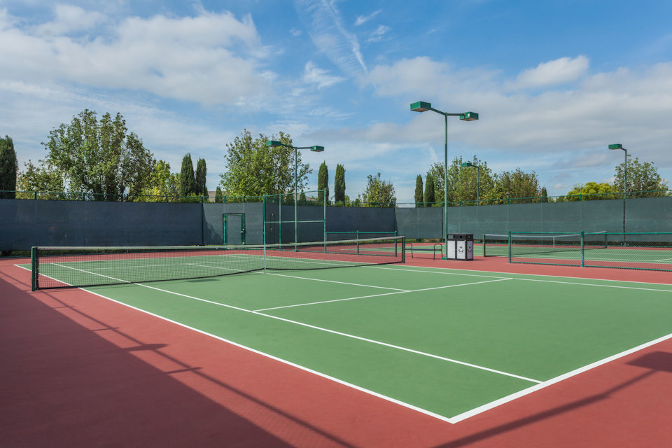 A tennis court with a net.