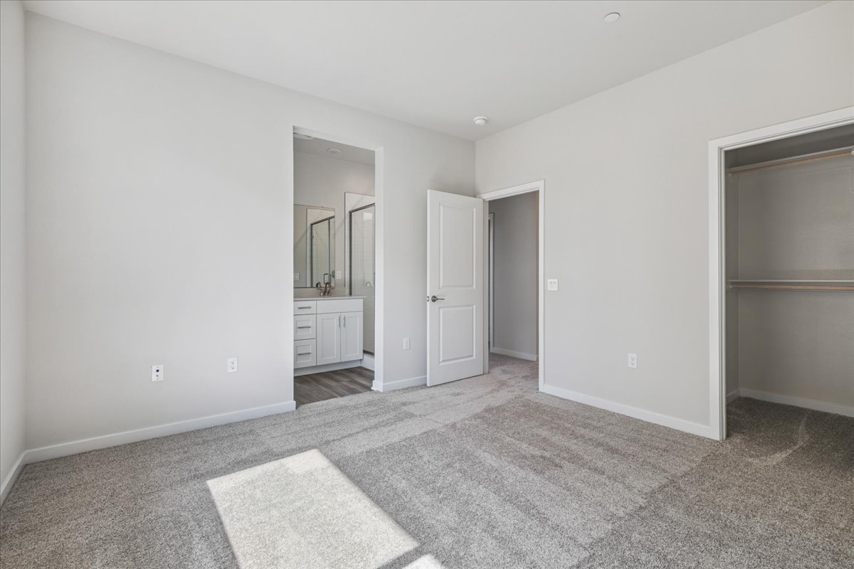 A bathroom with a large mirror.