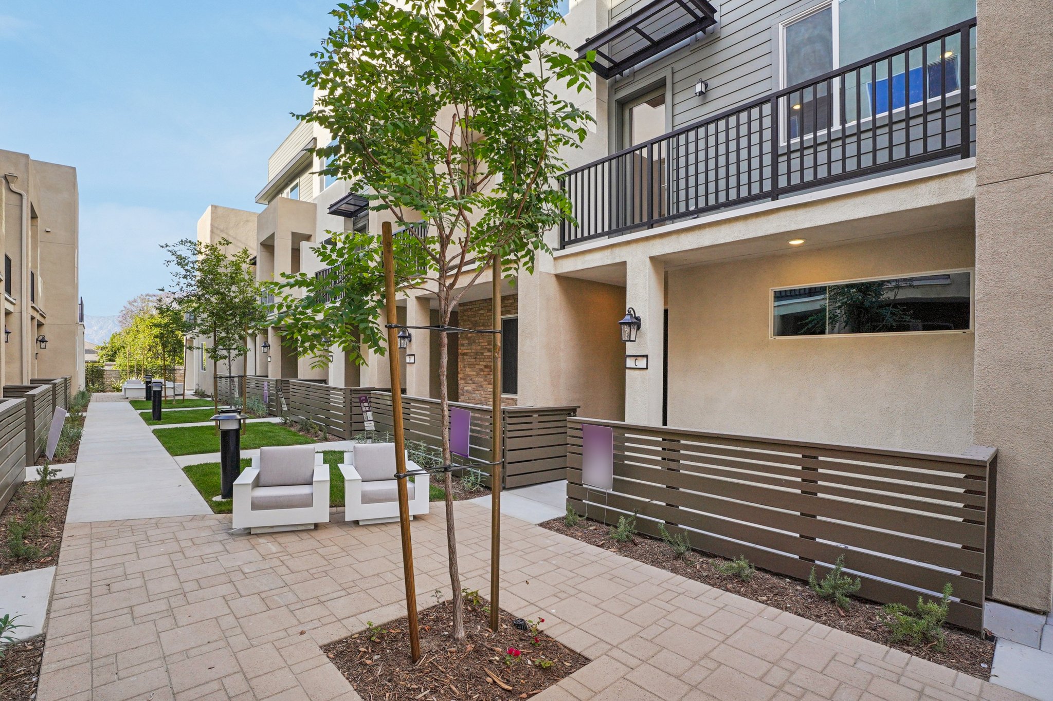 A brick walkway between buildings.
