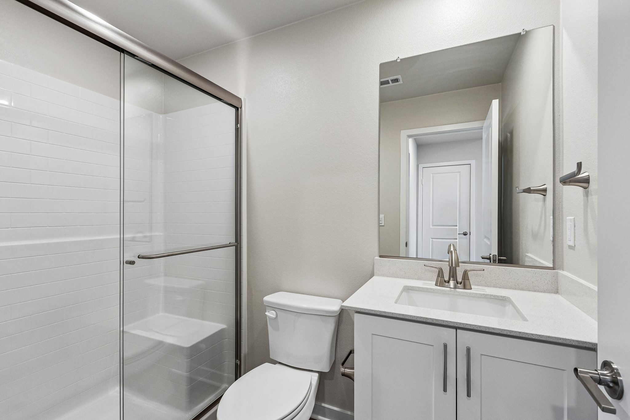 A bathroom with a glass shower.