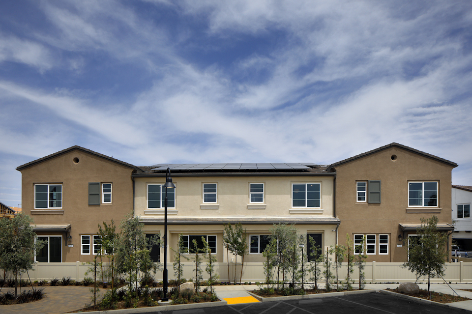 A building with trees in front.