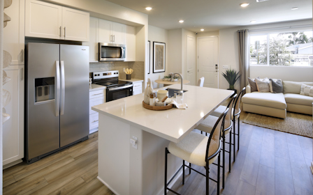 A kitchen with a dining table.