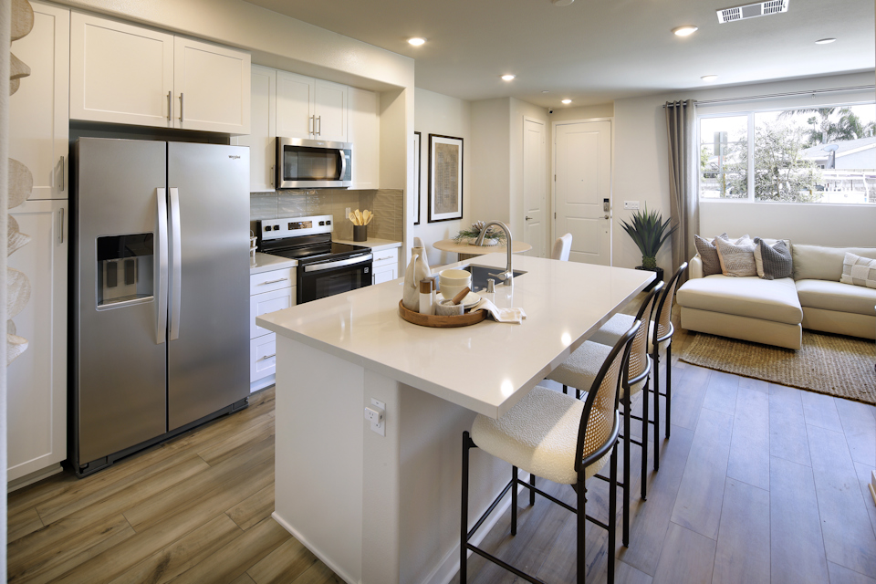 A kitchen with a dining table.
