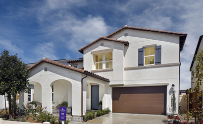 A white house with a garage.