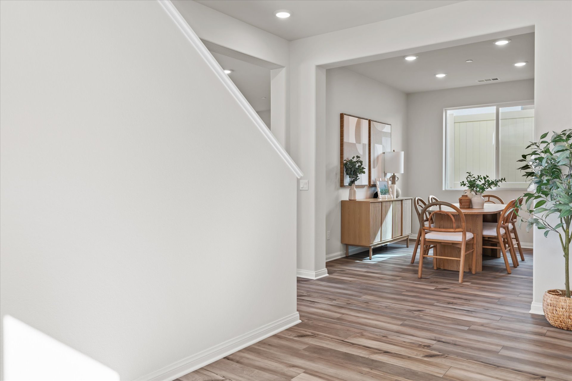 A room with a table and chairs.