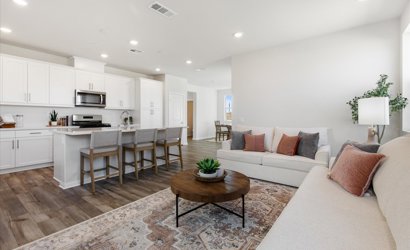 A large living room with a large kitchen and dining area.