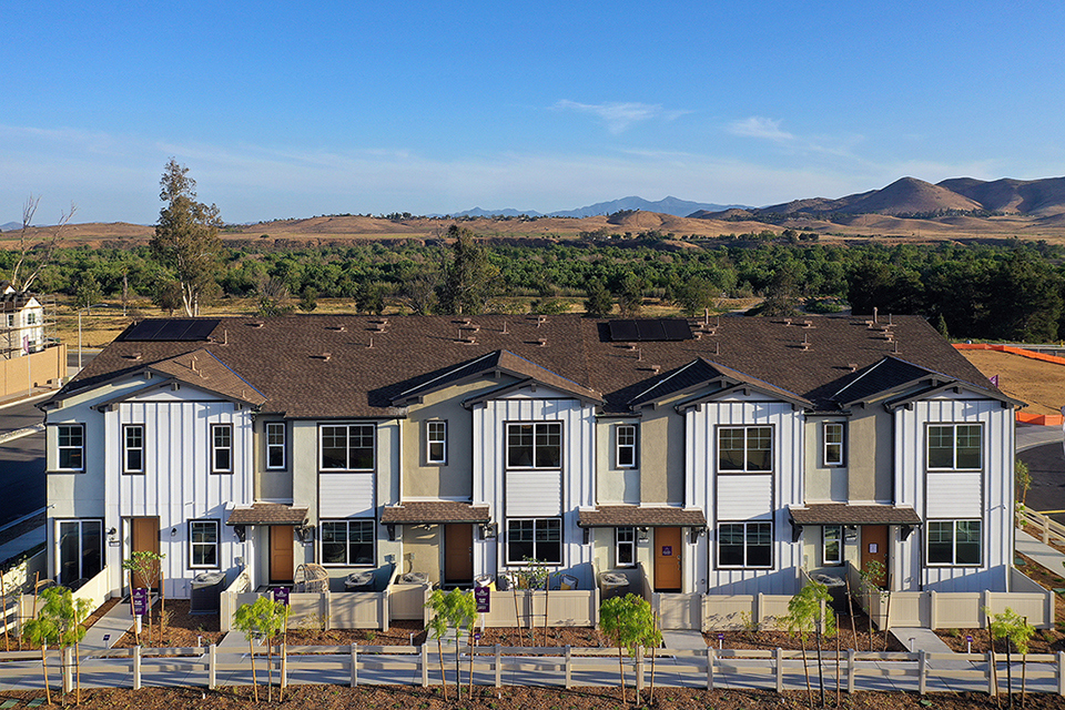 A large house with a fence around it.