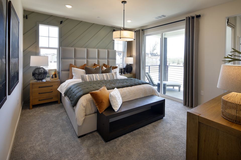 A bedroom with a large bed.