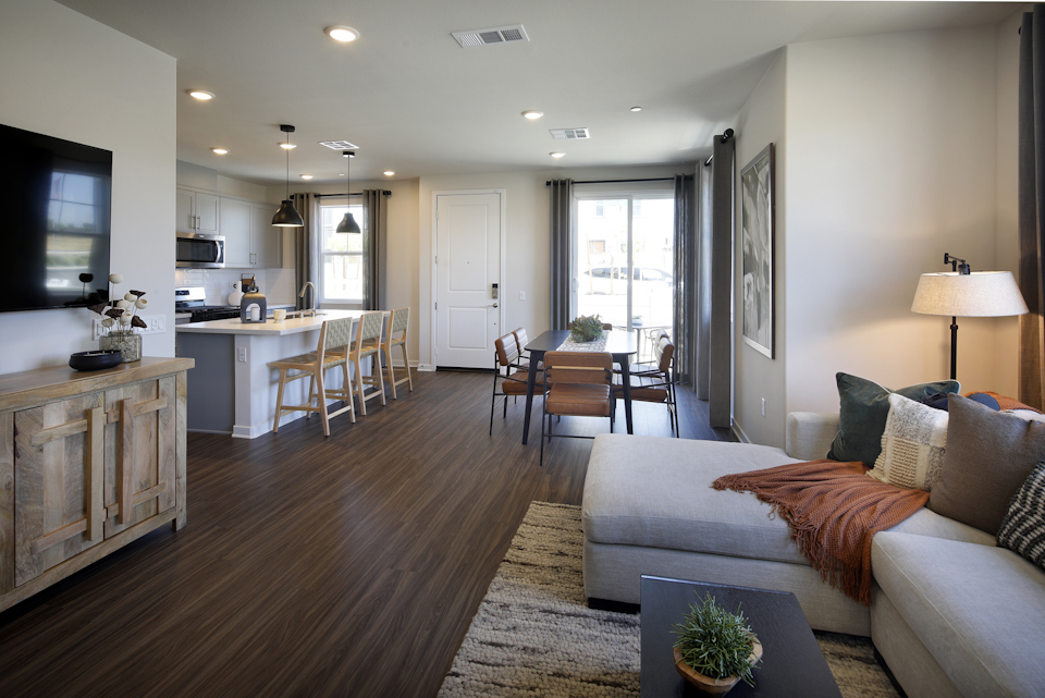 A living room with a wood floor.