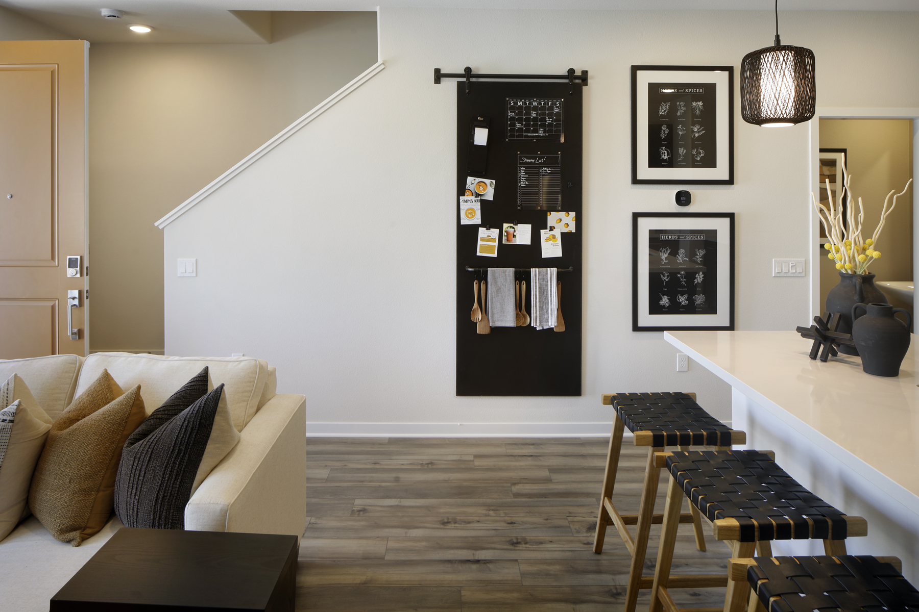 A room with a couch and a table with a chair and a table.