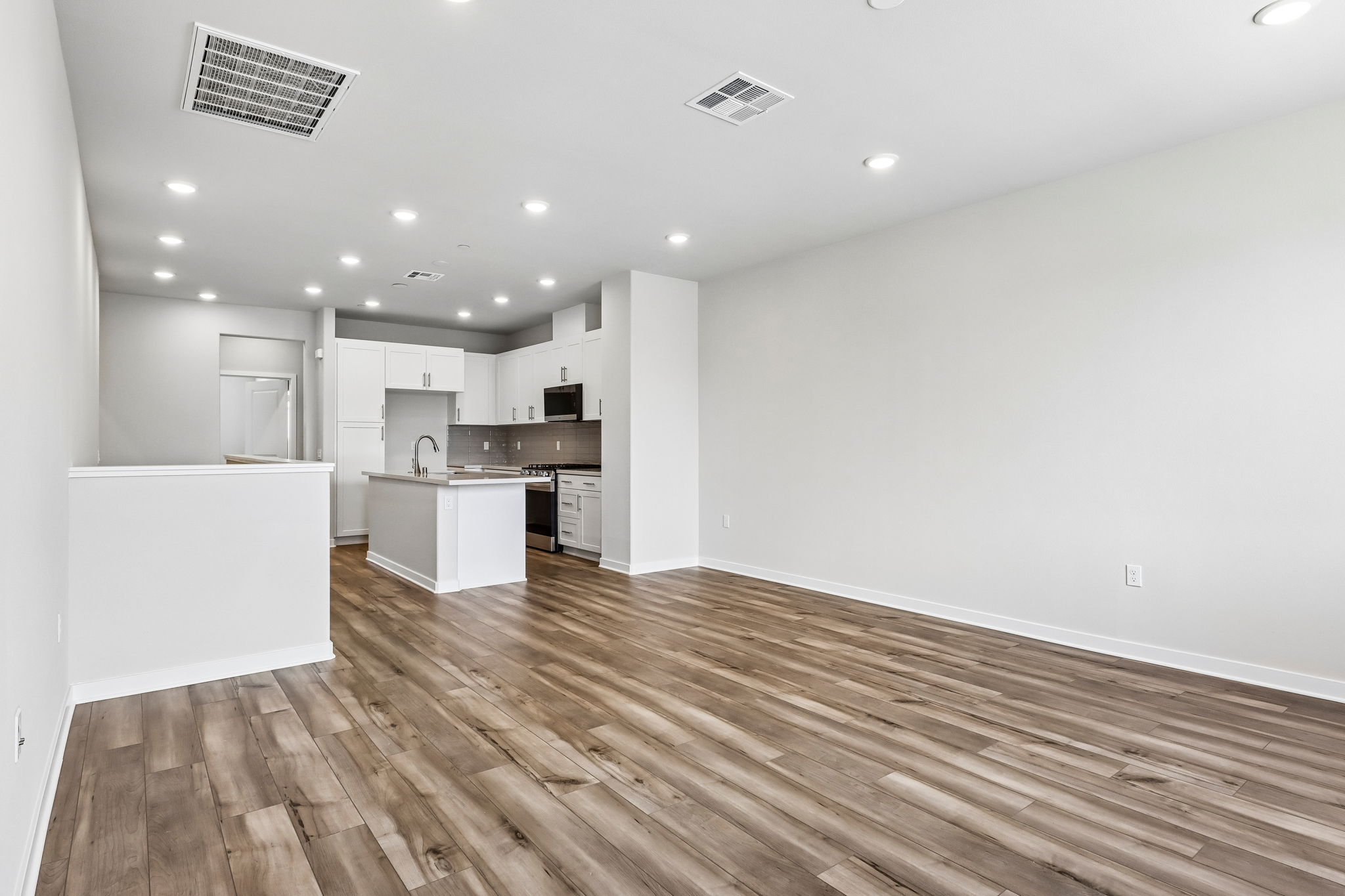 A kitchen with white walls.