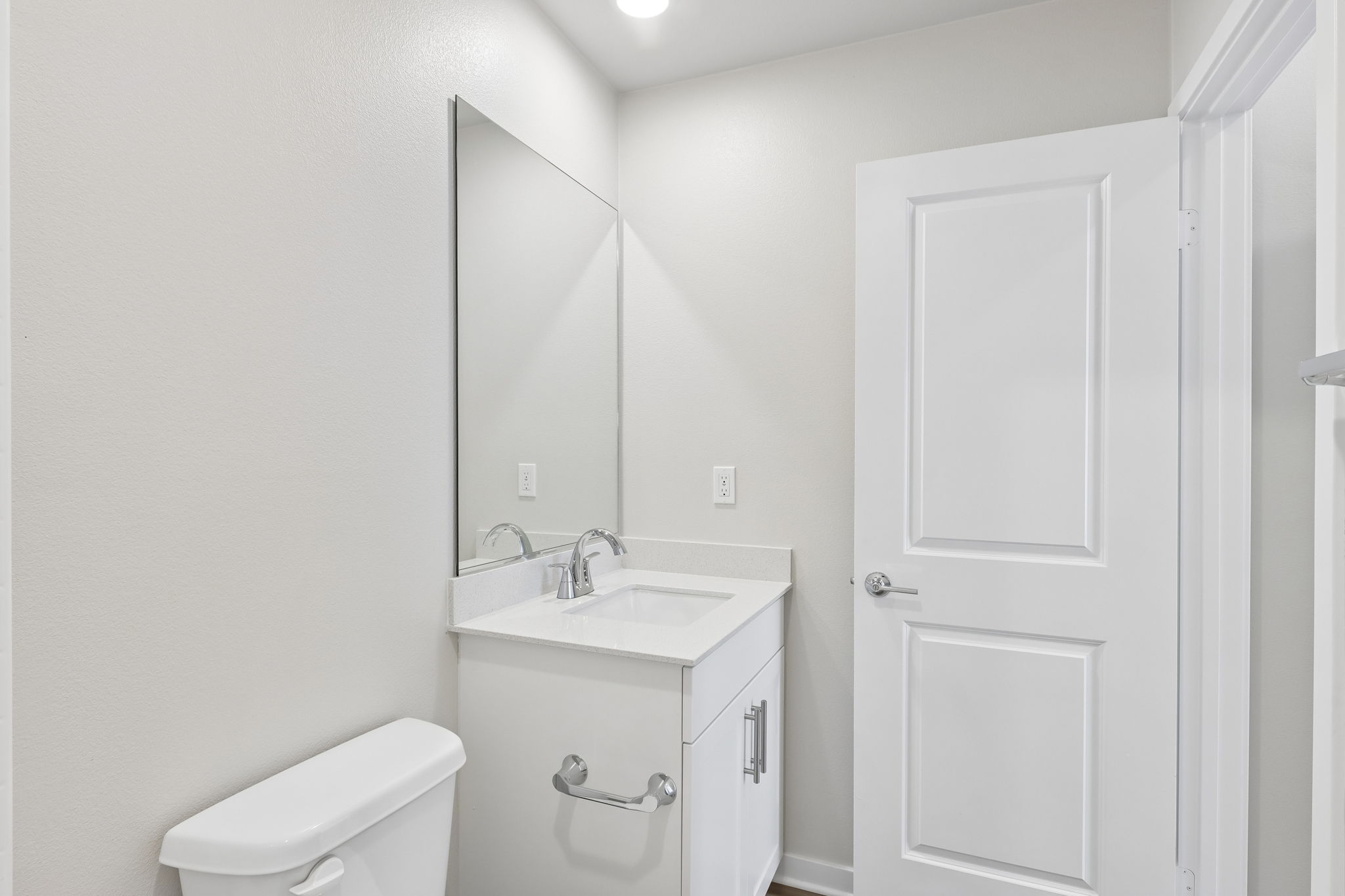 A bathroom with a sink and toilet.