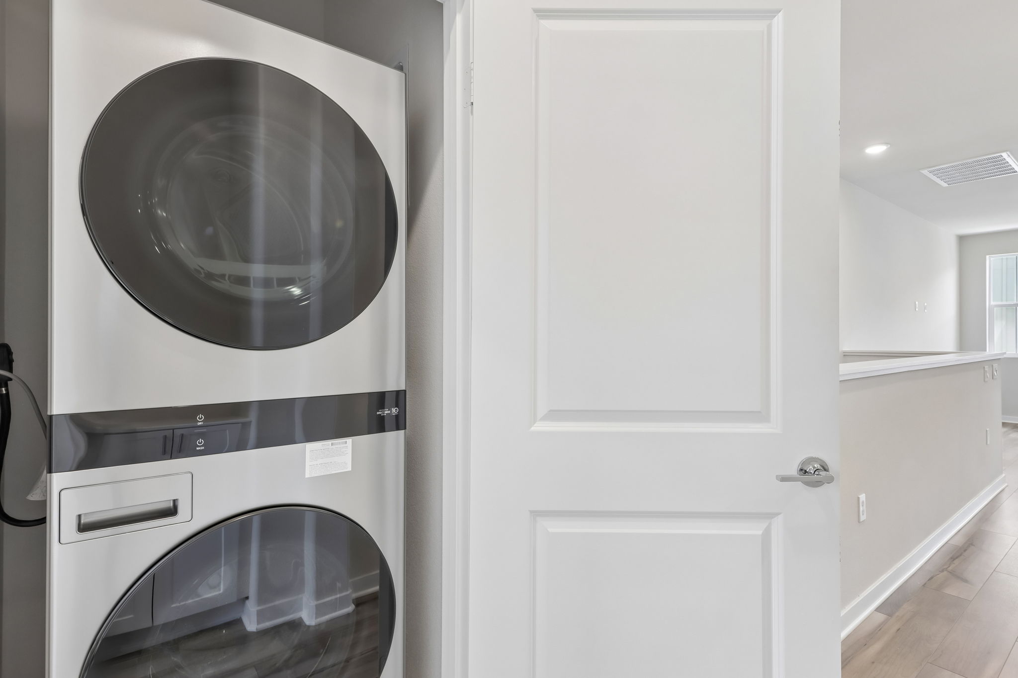 A white door with a mirror.