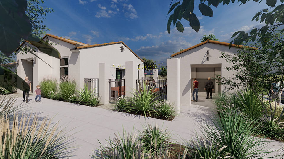 A group of people walking outside of a building.